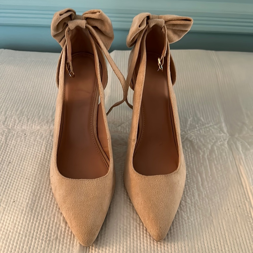Cute palms with bows on the heels and ankle strap